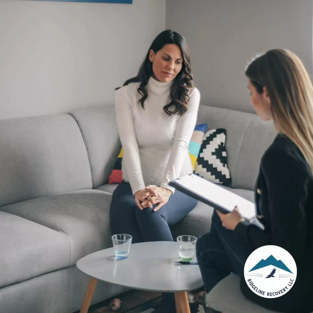 Addiction treatment with staff member talking to patient.