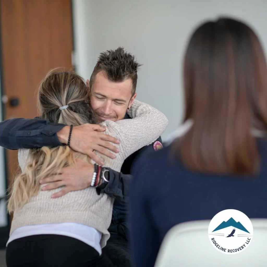 Man hugging the counselor after the group therapy, addiction therapy services