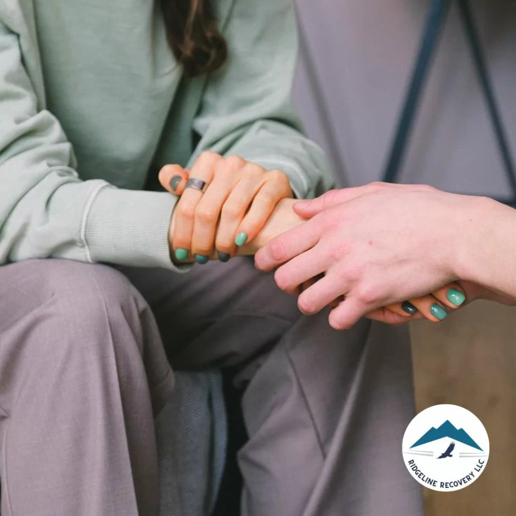 Staff holding the patient's hand