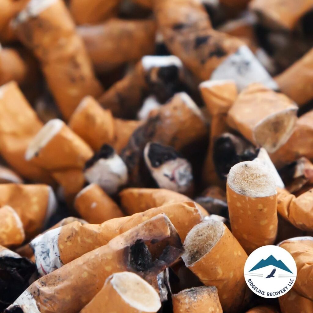 A close-up image of a pile of cigarette butts, symbolizing the physical manifestation of nicotine addiction. This image highlights the destructive impact of addiction and the need for professional help. Addiction Recovery programs in Columbus, Ohio, offer comprehensive therapy and support to help individuals overcome addiction and achieve lasting sobriety.