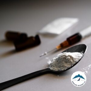 A close-up of a spoon filled with white powder, a syringe, and drug paraphernalia. This image highlights the dangers of substance abuse and the importance of Sober Houses in Columbus Ohio in providing a structured, drug-free environment for recovery.