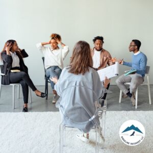 A group therapy session in a sober living home where participants engage in an interactive discussion. Inpatient rehab and Medicaid coverage can help individuals access structured support for long-term recovery.