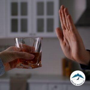 A person rejects a glass of alcohol, symbolizing commitment to Court Mandated Substance Abuse Treatment and the journey to sobriety.