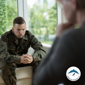 A military veteran in a therapy session, seeking professional support in a 2 Week Rehab Near Me program to overcome addiction and mental health challenges.