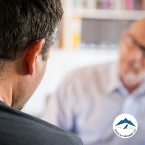 A man in an IOP program in Columbus, Ohio, receiving one-on-one counseling from an addiction specialist at Ridgeline Recovery.