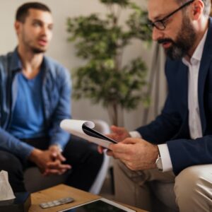 A therapist and client engaged in a DBT therapy Columbus Ohio session, discussing personalized strategies for mental health recovery.