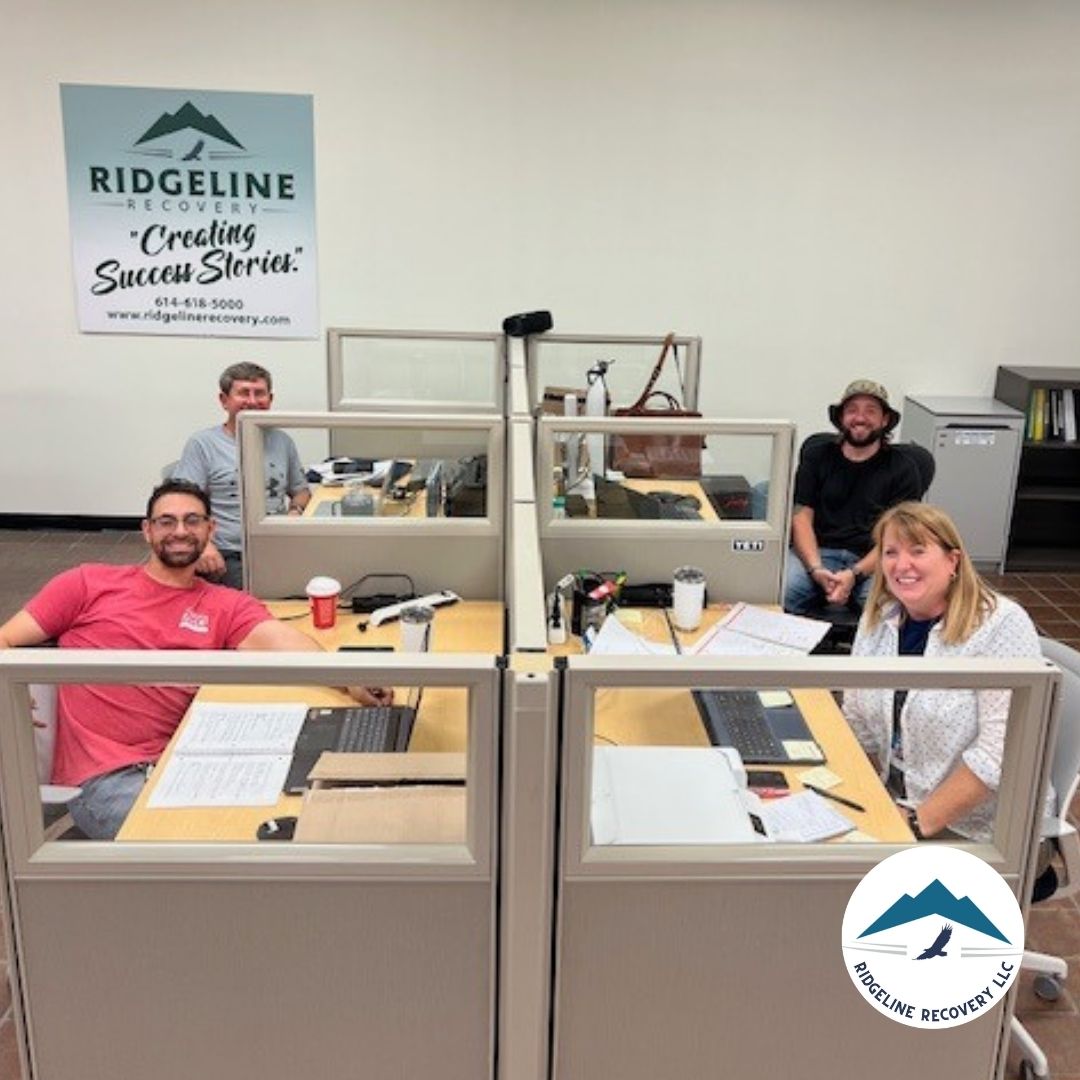 Clients and staff sharing a warm group hug at Ridgeline Recovery, reflecting the family atmosphere in addiction treatment Columbus.