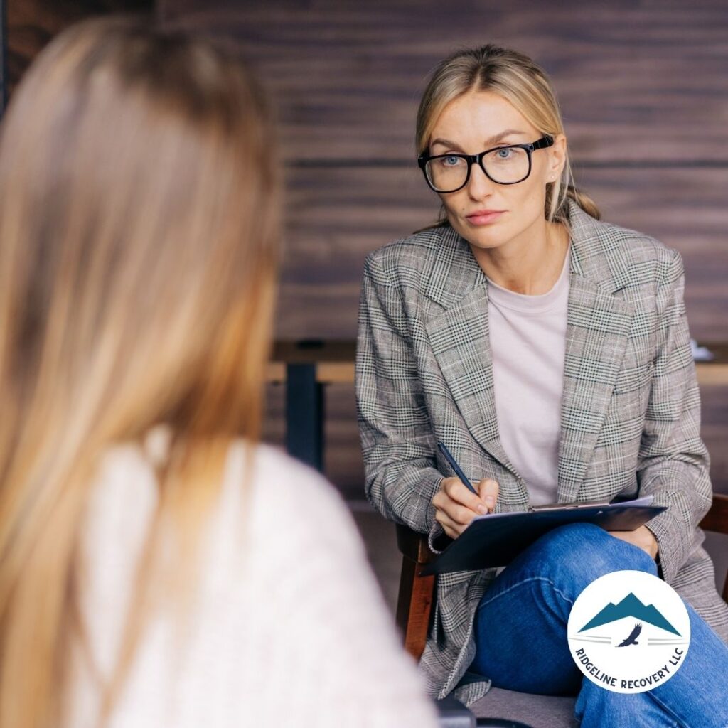 A therapist conducting a Cognitive Behavioral Therapy (CBT) session as part of addiction treatment Columbus, guiding a client through emotional management techniques.