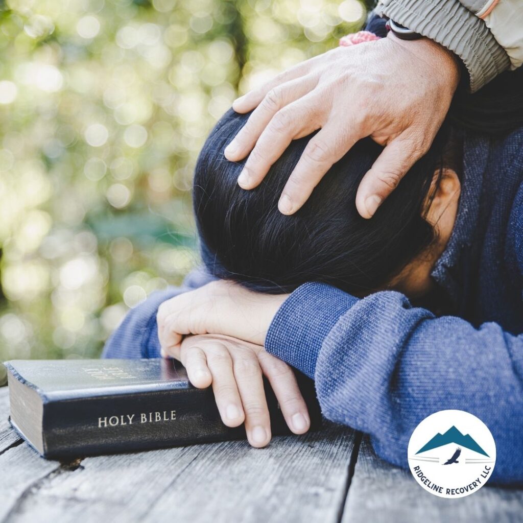 A counselor providing Christian spiritual guidance to a patient at an addiction treatment center in Columbus.