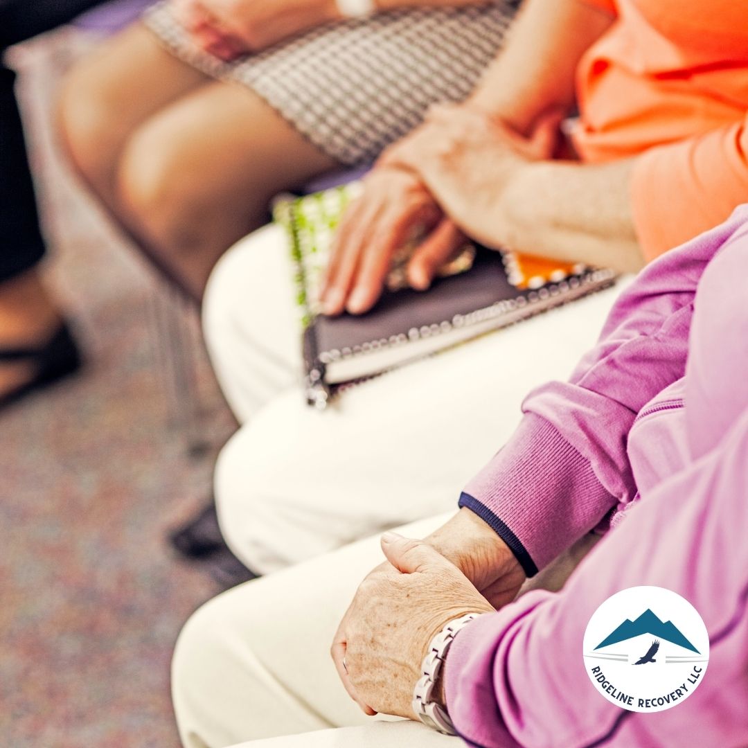 A patient reviewing different addiction treatment program brochures and discussing options with a specialist at a Columbus addiction treatment center.