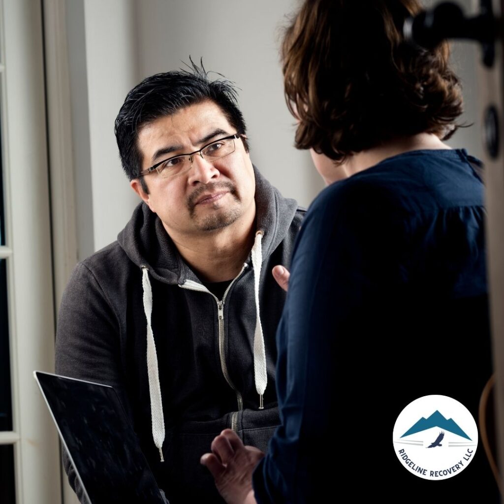 A patient receiving spiritual guidance from a pastor as part of their addiction recovery journey in Columbus.