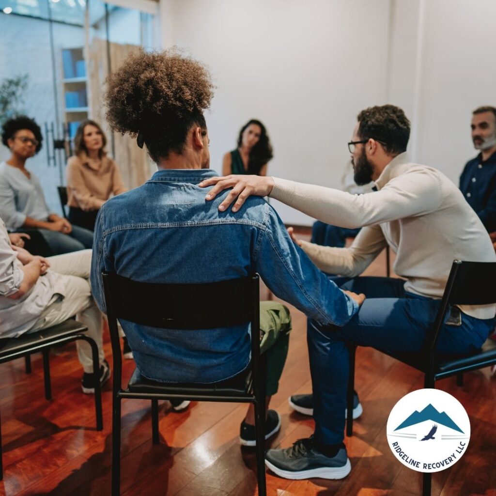 A therapist and a patient discussing a treatment plan during an Addiction Therapy session, highlighting the combination of counseling and medical treatment.