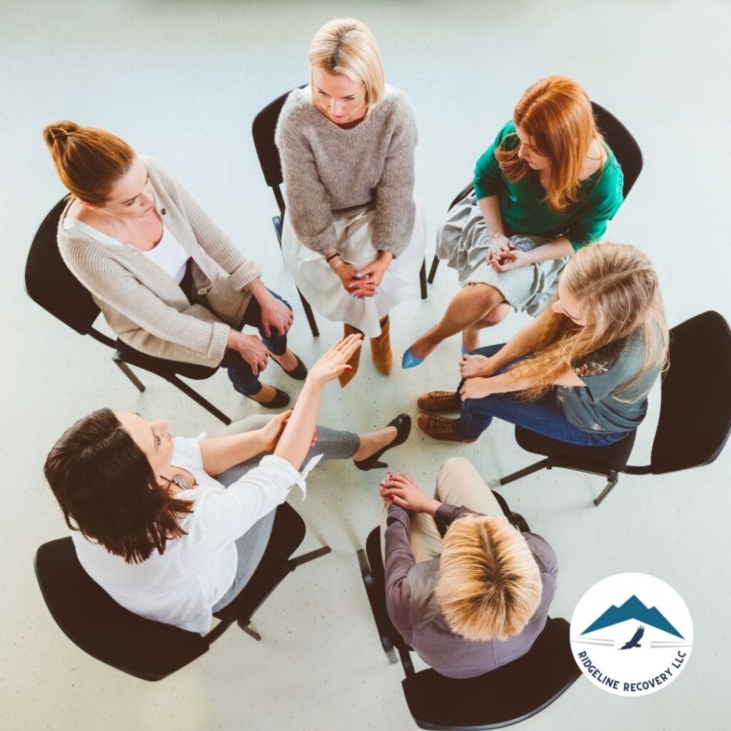 A therapist conducting an art therapy session for clients in Addiction Therapy.