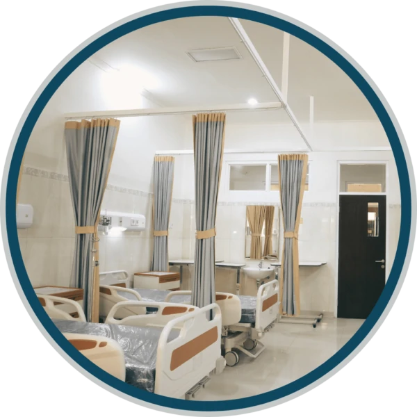 A hospital room featuring a comfortable bed, medical equipment, and a calming environment, illustrating the supportive setting for patients receiving care at Ridgeline Recovery.