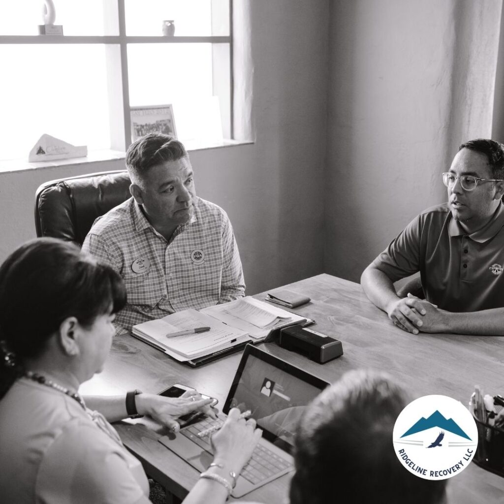 A person in a group therapy session discussing social pressures during Addiction Treatment Columbus.