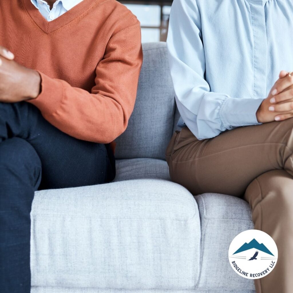 A therapist conducting a one-on-one session, providing personalized addiction therapy services to a client in a private office.