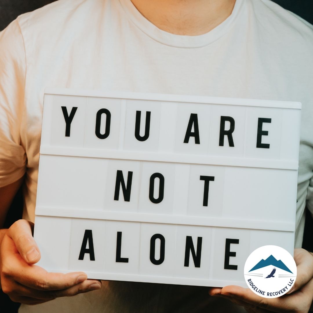 A therapist guiding a client through addiction treatment in a supportive environment.