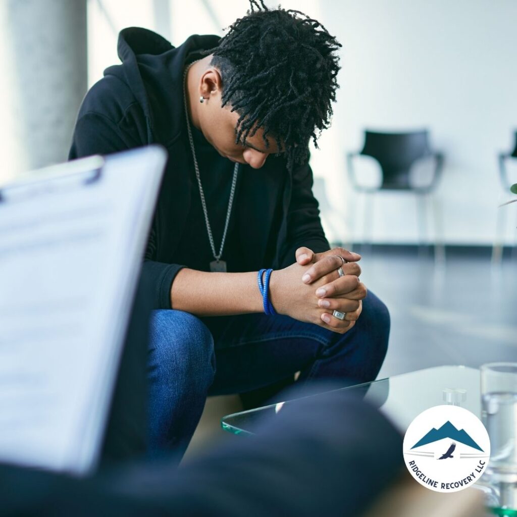 A caring therapist providing hands-on support to a client during a counseling session at an addiction treatment center near me.