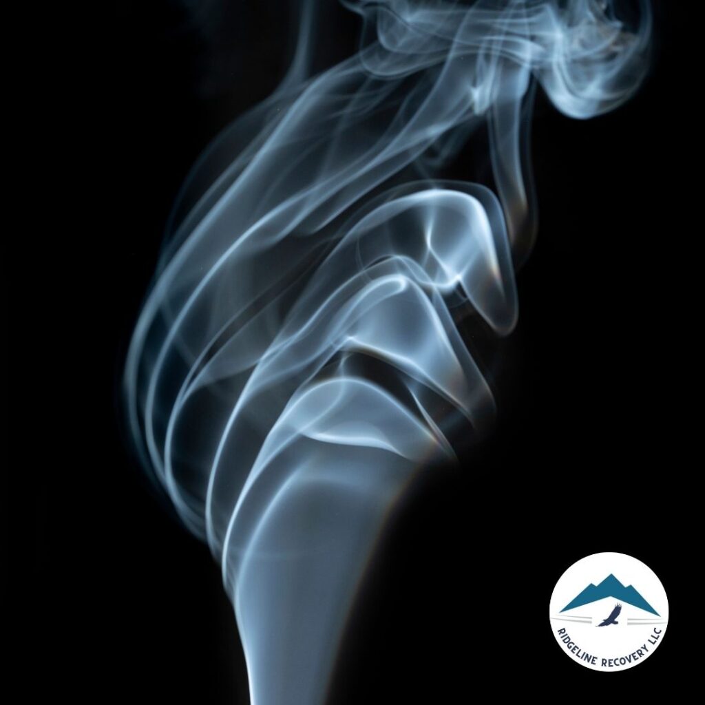 A wisp of smoke curling and disappearing against a dark background, symbolizing the elusive and addictive nature of substances. This image highlights the complexity of addiction and the need for personalized therapy to overcome it. Addiction Recovery Columbus