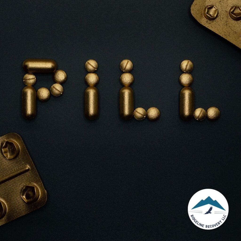 The word "PILL" spelled out using various pills and capsules, symbolizing the role of medication-assisted treatment (MAT) in addiction recovery Columbus. MAT, when combined with therapy and counseling, can significantly improve treatment outcomes and increase the chances of long-term sobriety.