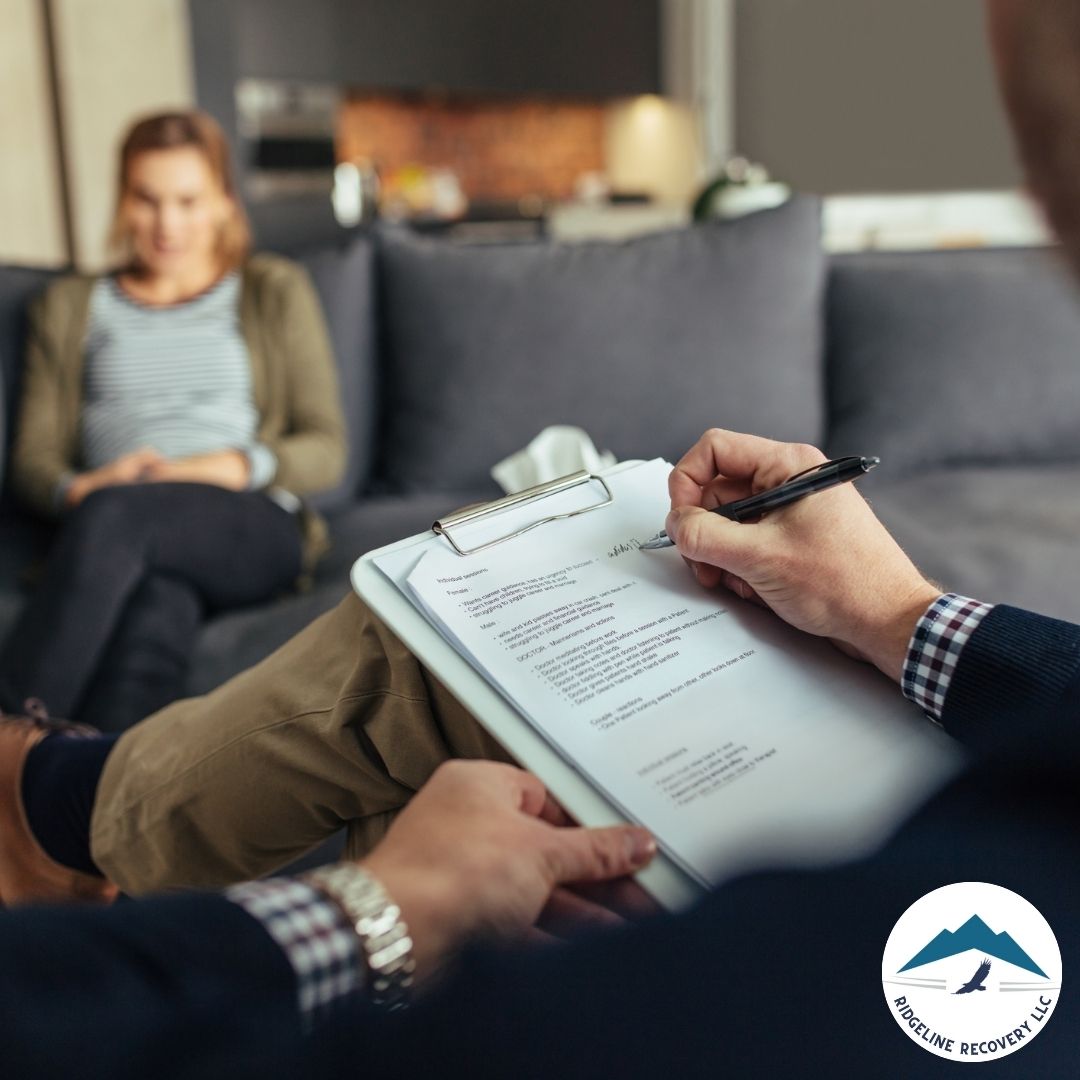 A person sitting on a chair, talking to a therapist, symbolizing hope and a new beginning after addiction treatment columbus.