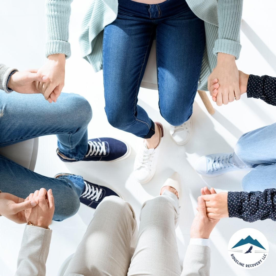 A group of people in a supportive therapy session, symbolizing the collaborative approach of effective addiction treatment programs in Columbus.