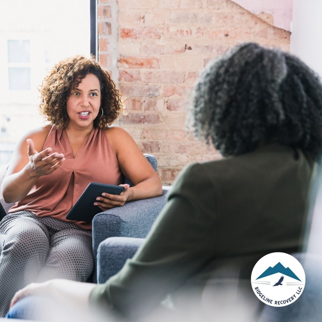 A therapist and a client engage in a meaningful conversation in a counseling session focused on addiction recovery. This discussion aligns with the Living in Balance approach, which emphasizes structured therapy and self-reflection to achieve long-term sobriety.