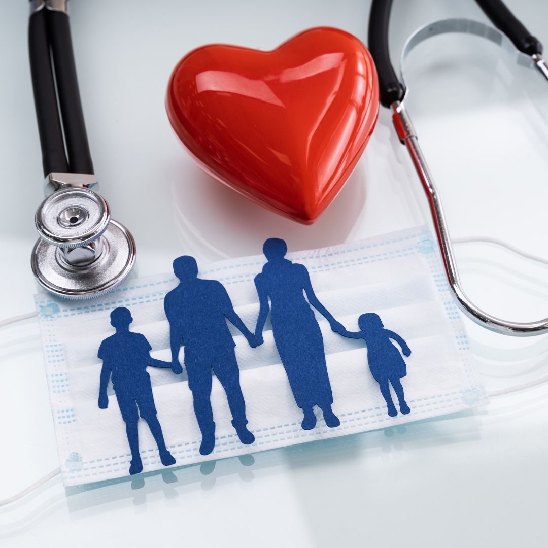 A stethoscope, red heart, and a blue family cutout on a face mask, symbolizing the importance of holistic mental health and addiction treatment at Lifestance Health Columbus Ohio.