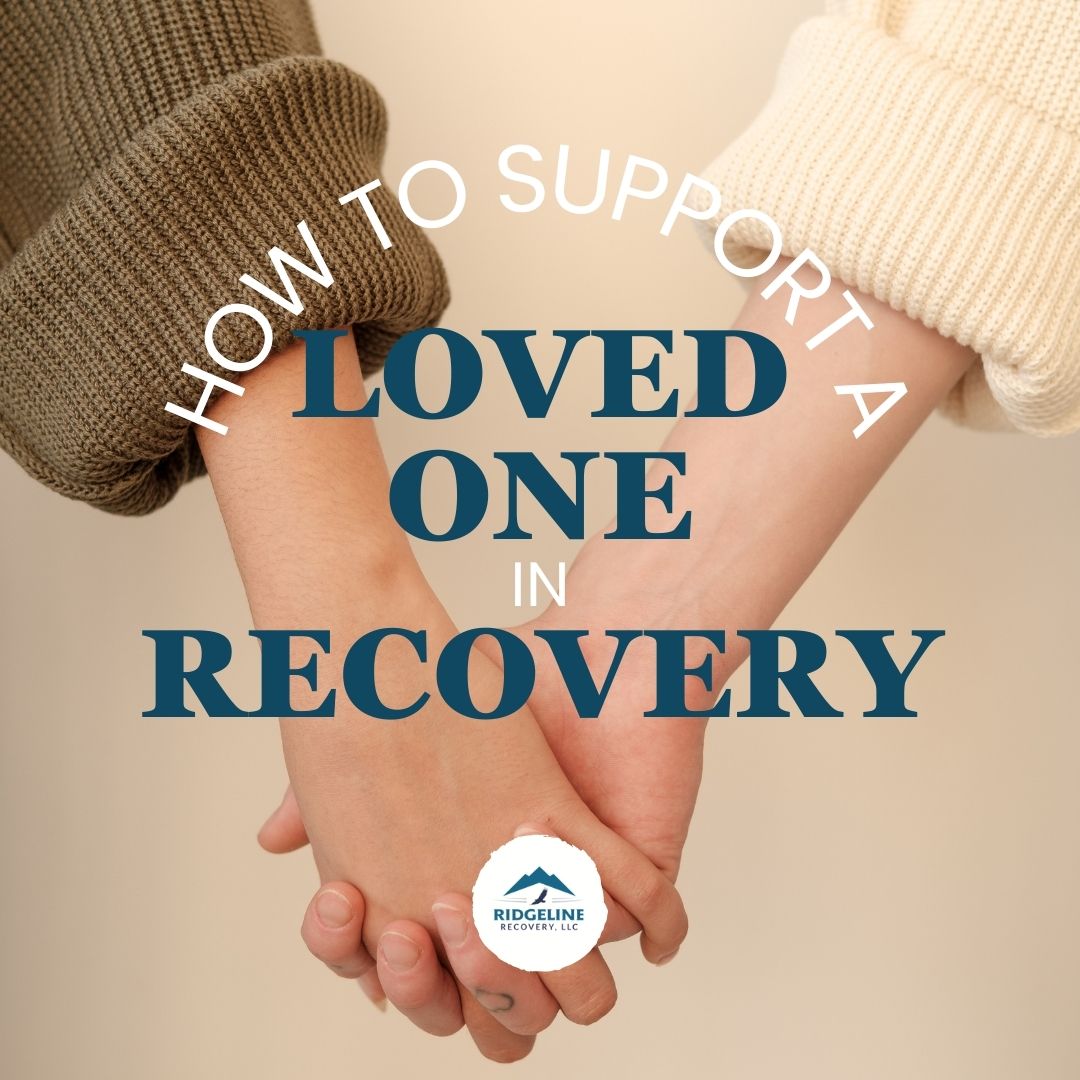 Two people holding hands, symbolizing support and connection. The text overlay reads: How to Support a Loved One in Recovery, with the Ridgeline Recovery logo at the bottom.