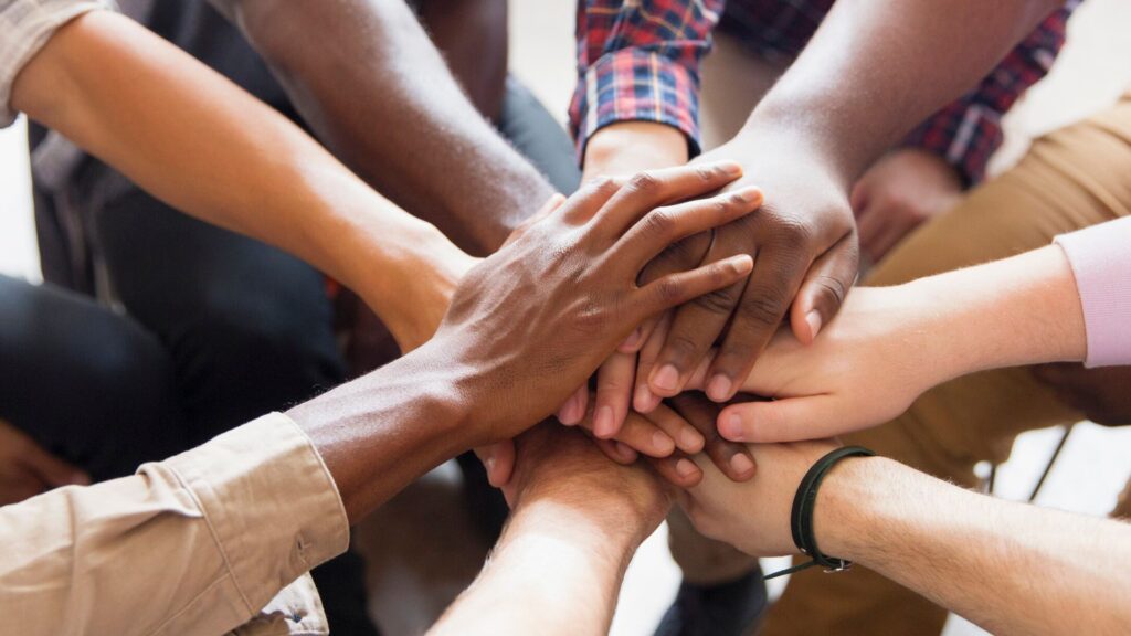 A diverse group of people in a recovery-focused group counseling session in Columbus.
