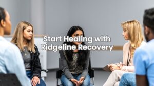 Individuals in addiction therapy offering emotional support to one another through shared connection.