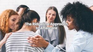 A therapist guiding a group therapy session for individuals in aftercare support.