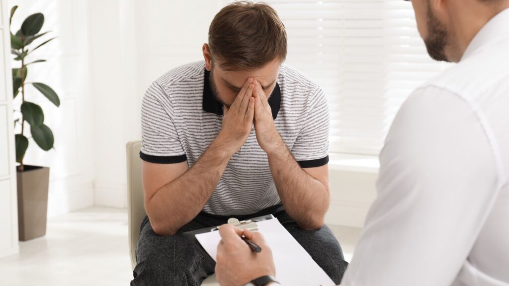 A counselor and client in one-on-one therapy at a drug and alcohol rehab center.