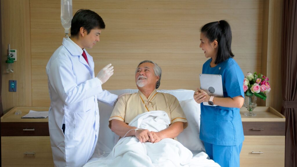 A doctor and a nurse working with patients in an inpatient rehab facility.