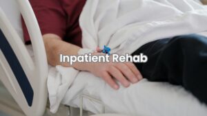 A patient lying down calmly in a peaceful inpatient rehab room with natural lighting.