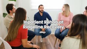 A group of people in recovery attending a therapy session inside an inpatient rehab center.