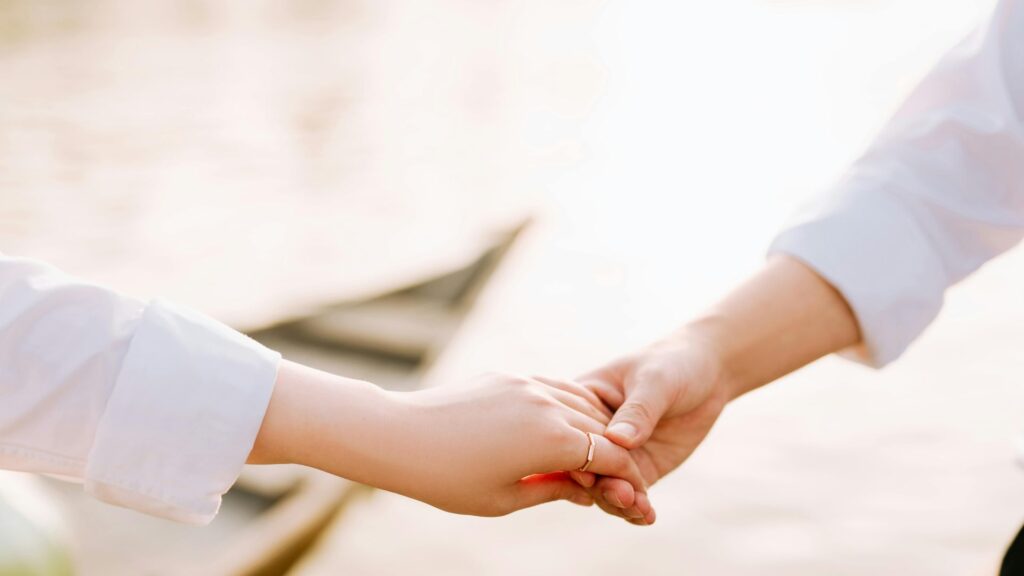 Hands interlocked, showing partnership and unity during addiction treatment and couples rehab in Ohio.