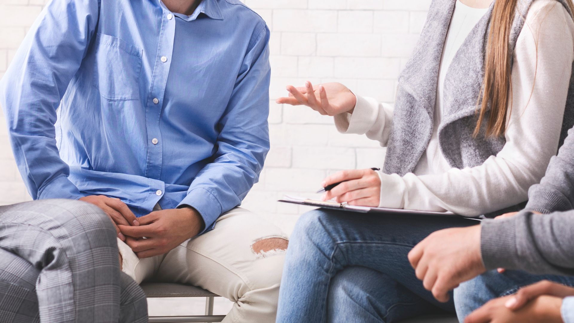 Inpatient vs Outpatient Rehab. A group of people sitting in a circle during a therapy session, a key component of both inpatient vs outpatient rehab programs.